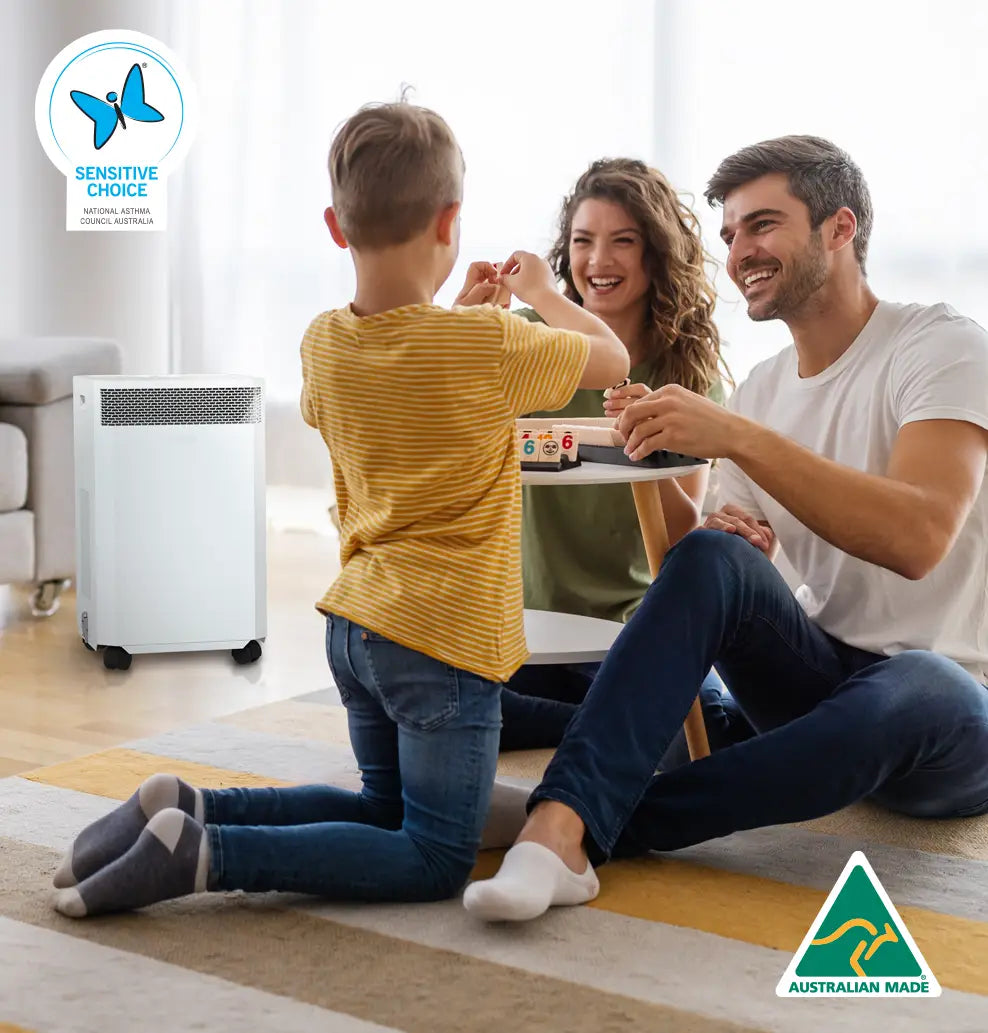 Family with INOVA DE20 Air Purifier. Australian Made and Sensitive Choice logos.