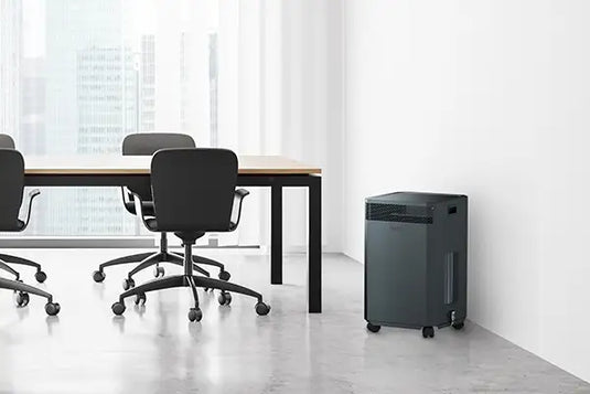 black inova air purifier in office space