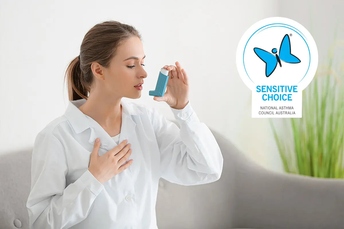 A woman using an inhaler with the Sensitive Choice logo.