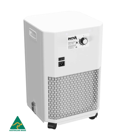 A white INOVA air purifier with a front vent grille, black wheels, and a control dial on the front panel, shown on a white background with an Australian Made logo in the bottom-left corner.