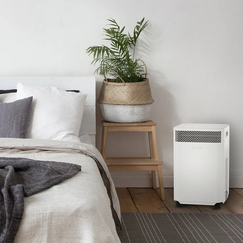 INOVA E8 air purifier in a bedroom